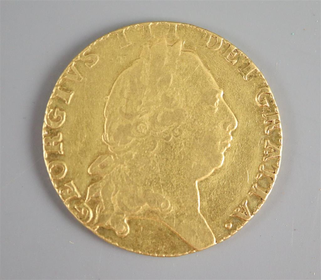 A George III gold guinea, 1794, fifth laureate head, spade shield